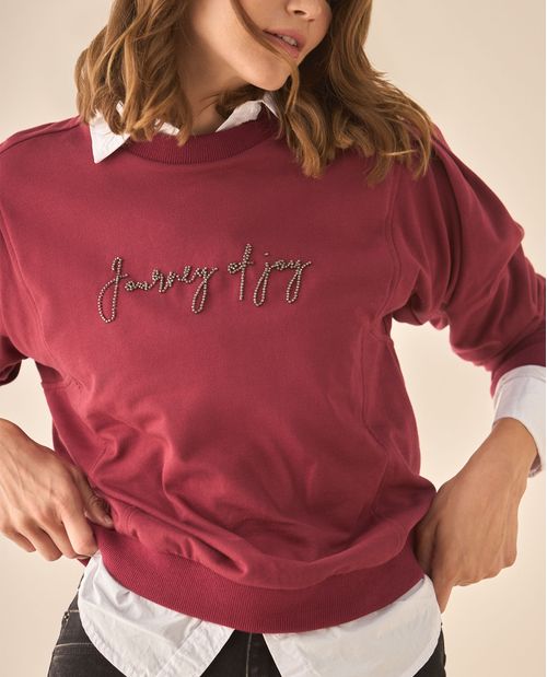 Buzo con detalles bordados para mujer